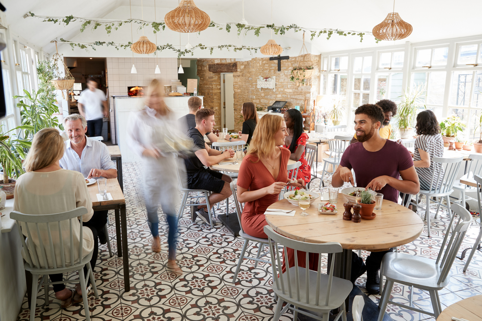 Lunchtime Customers Eating at a Busy Restaurant